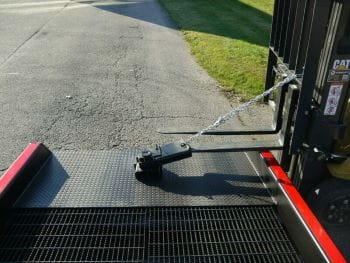 yard ramp positioning sleeve and tow bar positioning sleeve on a yard ramp