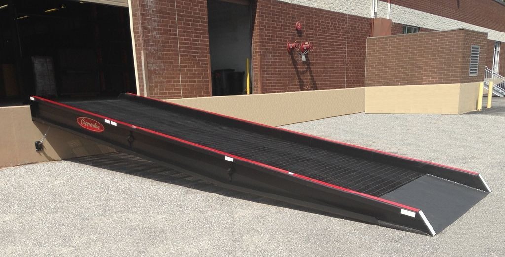 stationary loading dock ramps to warehouse Stationary loading dock ramp connected to a warehouse
